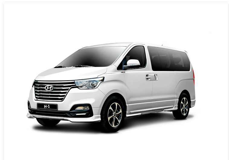 White passenger van for Epic Adventures group tours